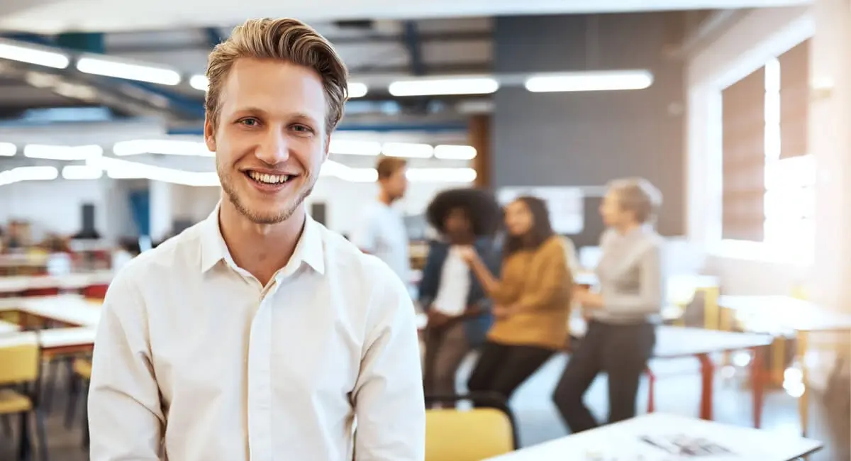 Young man smilling int white shirt